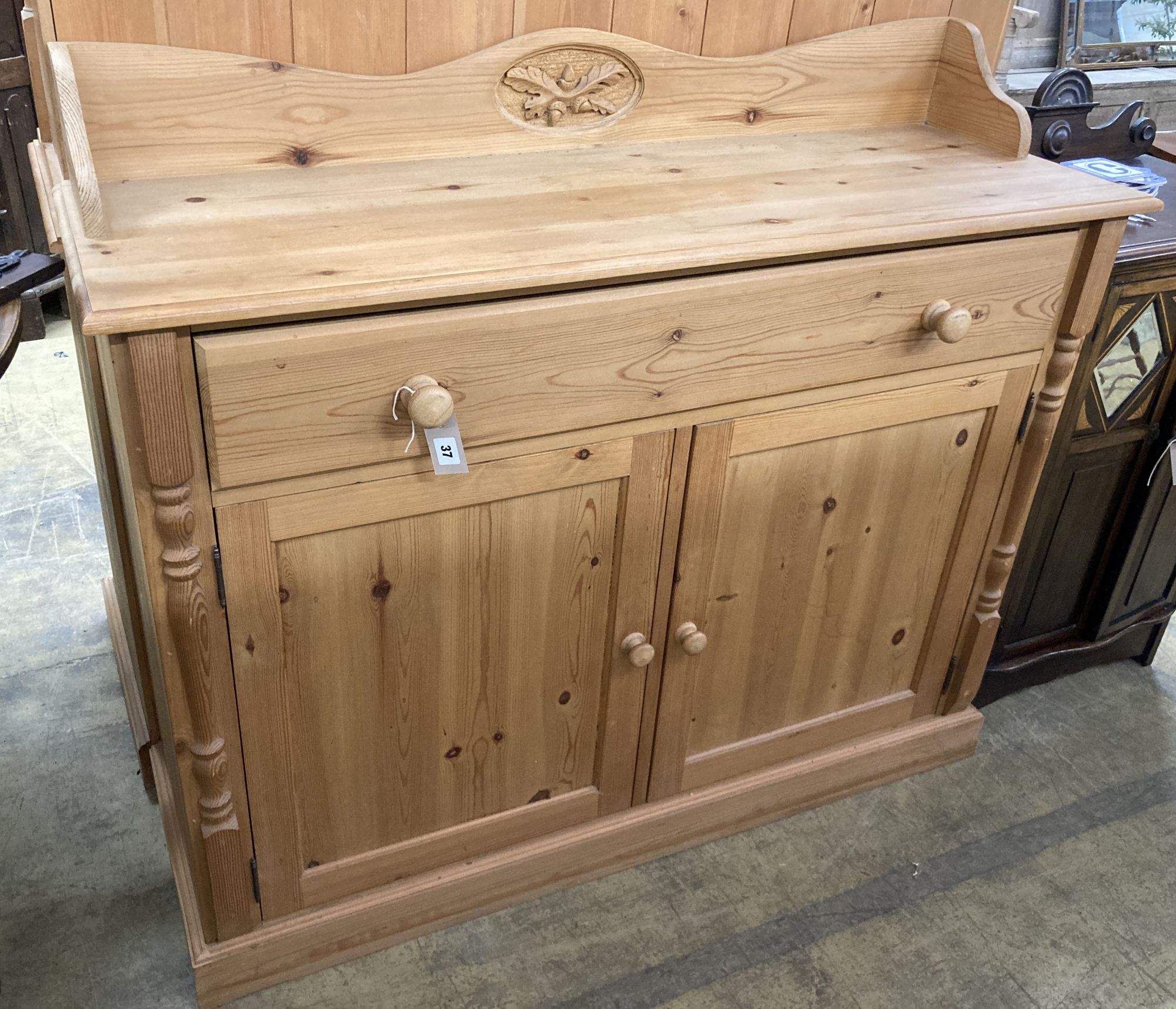 A reproduction pine sideboard, length 122cm, depth 40cm, height 106cm